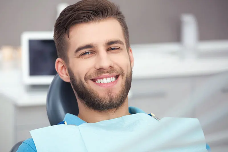 Smiling man in dental chair