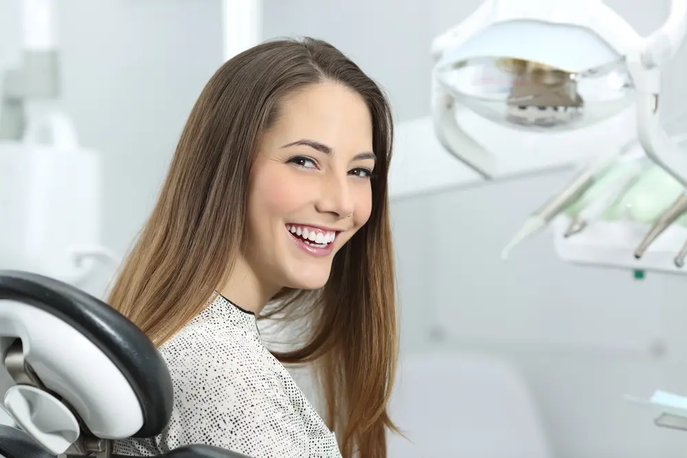 Smiling woman in dentist chair
