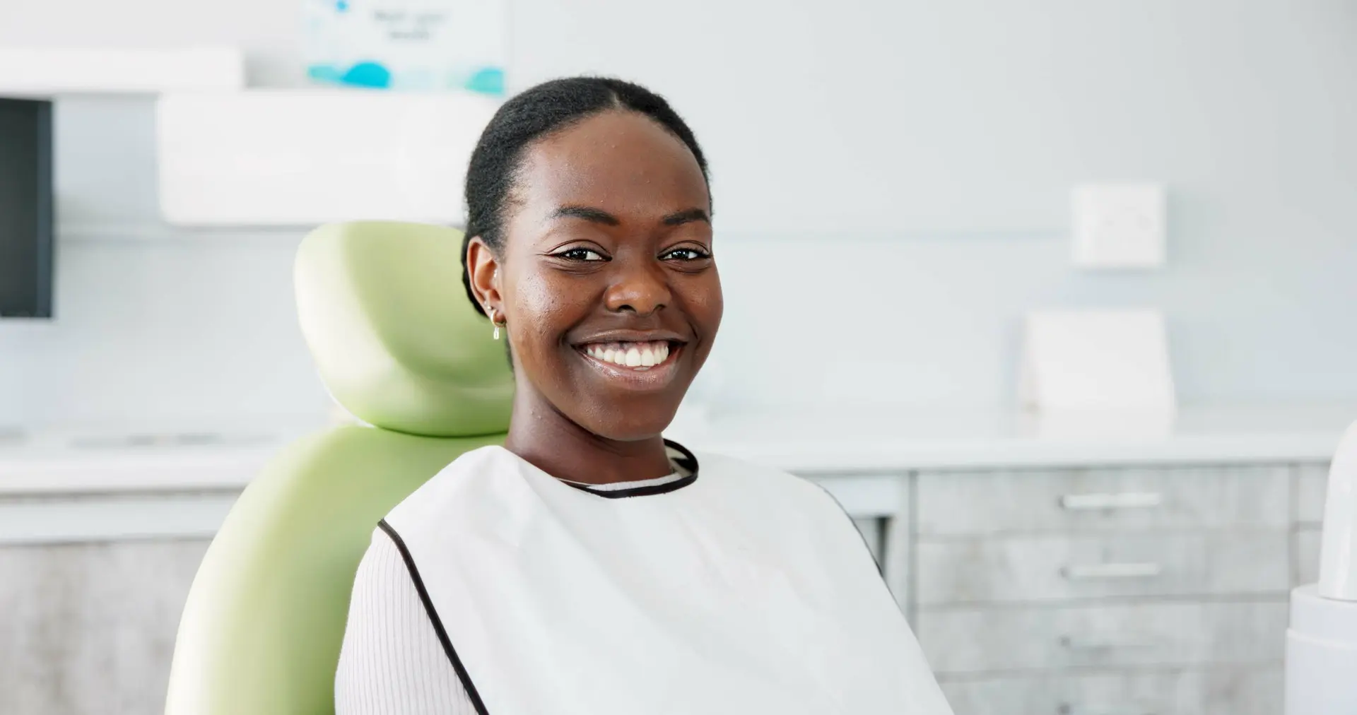 Woman smiling at dental clinic