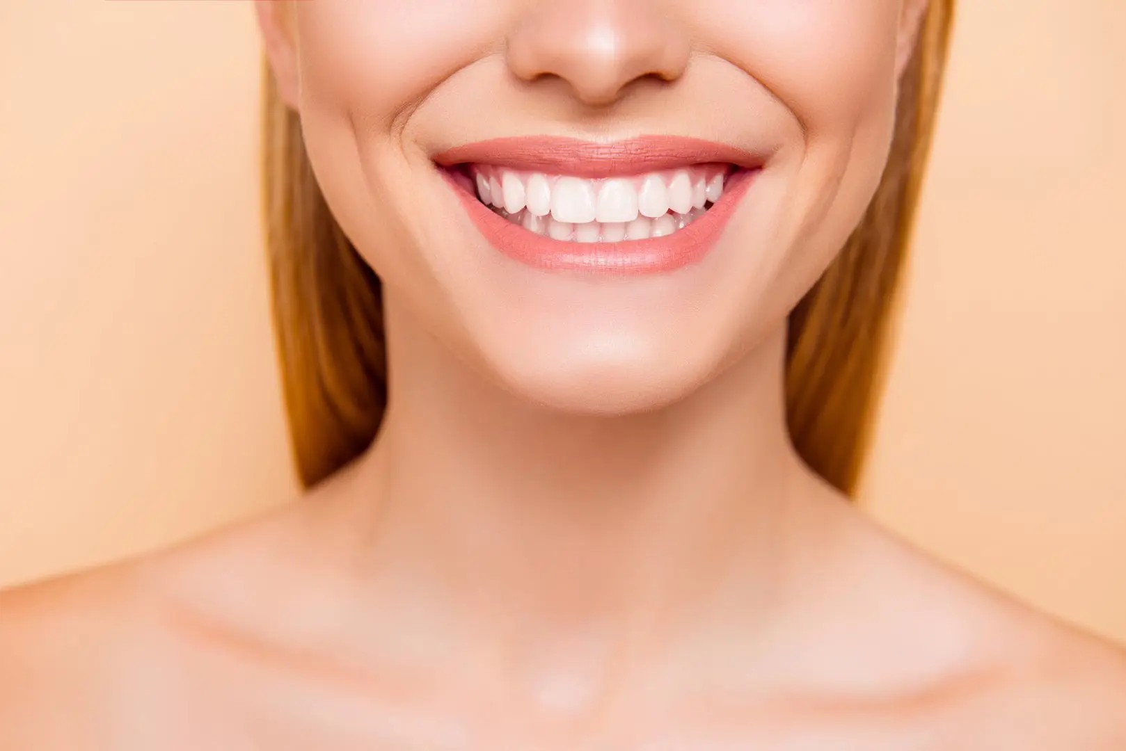Happy smile on peach background