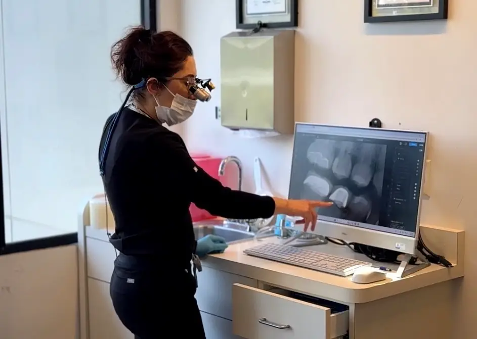 Dentist examining digital dental X-ray