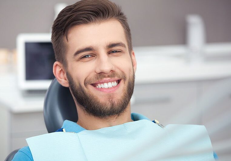 Smiling man in dental chair