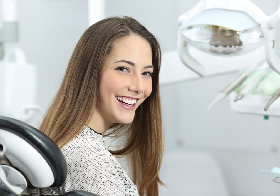 Smiling woman in dentist chair