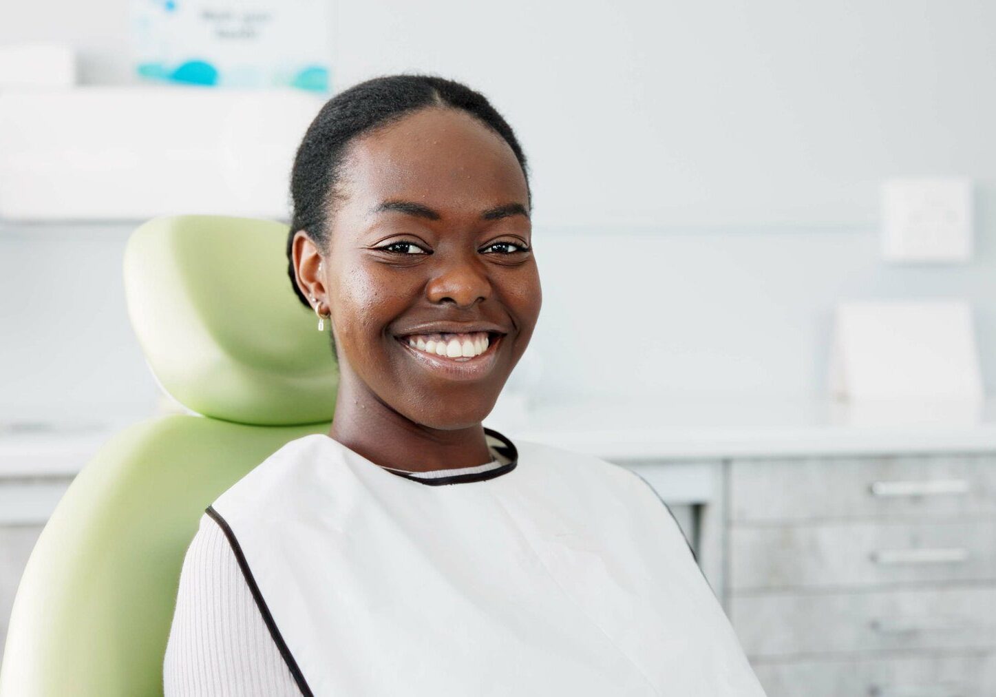 Woman smiling at dental clinic