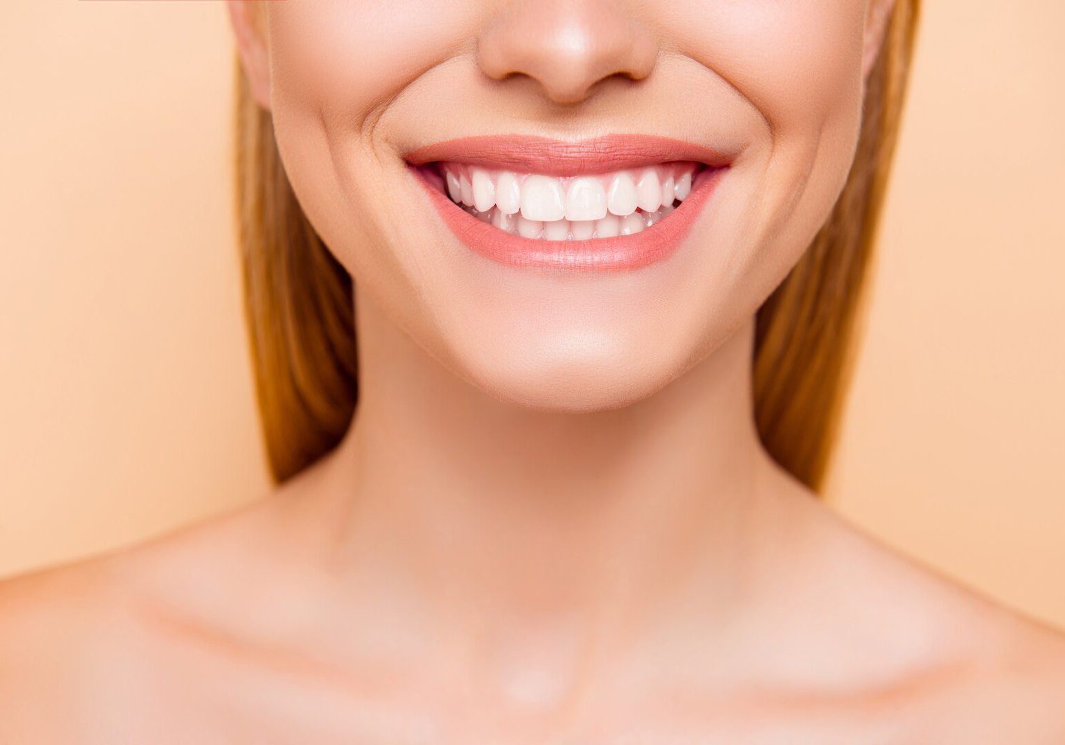 Happy smile on peach background